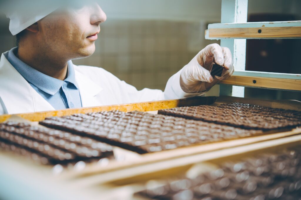 Chocolate factory worker makes sure food is up to SQF code